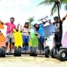 Tour participants on Segway scooters at Siloso Beach, Sentosa 